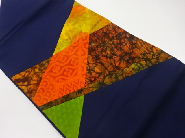 切り嵌め花唐草に古典柄・抽象模様織出し名古屋帯